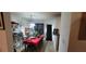 Dining room with a red tablecloth and wooden chairs at 1771 Fielding Way, Hampton, GA 30228