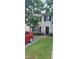 Two-story house with a landscaped lawn and a black door at 1771 Fielding Way, Hampton, GA 30228