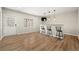 Finished basement with a bar, pendant lights and luxury vinyl flooring at 7250 Weber St, Atlanta, GA 30349