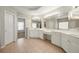 Large Primary bathroom with double vanity and tile floors at 7250 Weber St, Atlanta, GA 30349