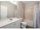 Clean bathroom with a shower/tub combo and white vanity at 7250 Weber St, Atlanta, GA 30349