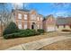 Two-story brick home with a large front yard and mature trees at 7250 Weber St, Atlanta, GA 30349