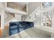 Sunlit living room with high ceilings and a large sectional sofa at 7250 Weber St, Atlanta, GA 30349