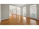 Hardwood floor living room with an open floor plan and lots of natural light at 7250 Weber St, Atlanta, GA 30349