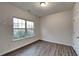 Bright bedroom with wood-look flooring and a window at 4146 Shoals Pt, Union City, GA 30291