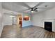 Open concept living room with kitchen view and fireplace at 4146 Shoals Pt, Union City, GA 30291