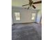 Spacious bedroom with carpet, ceiling fan, and large windows at 575 Dunagan Drive, Lawrenceville, GA 30045