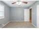 Simple bedroom with gray walls, carpet flooring and window with blinds at 3597 Fairlane Nw Dr, Atlanta, GA 30331