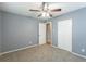 Bright bedroom featuring gray walls, carpet, and built-in closet at 3597 Fairlane Nw Dr, Atlanta, GA 30331