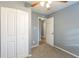 Bright bedroom featuring gray walls, carpet, and built-in closet at 3597 Fairlane Nw Dr, Atlanta, GA 30331