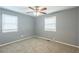 Spacious bedroom with neutral walls, carpet, ceiling fan and window blinds at 3597 Fairlane Nw Dr, Atlanta, GA 30331
