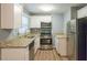 Modern kitchen with stainless steel appliances and granite counters at 3597 Fairlane Nw Dr, Atlanta, GA 30331