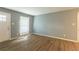 Spacious living room featuring hardwood floors and large window at 3597 Fairlane Nw Dr, Atlanta, GA 30331