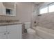 Clean bathroom with granite countertop, white cabinets, and marble shower/tub at 4557 Greenleaf Sw Cir, Atlanta, GA 30331