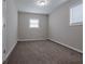Spacious bedroom with neutral walls and carpet flooring at 4557 Greenleaf Sw Cir, Atlanta, GA 30331