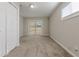 Bright bedroom with carpeting, double door closet and sliding glass door to backyard at 4557 Greenleaf Sw Cir, Atlanta, GA 30331