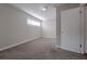 Cozy bedroom with carpeting and a large window at 4557 Greenleaf Sw Cir, Atlanta, GA 30331