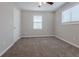 Charming bedroom with neutral walls, carpet, and ceiling fan at 4557 Greenleaf Sw Cir, Atlanta, GA 30331