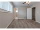 Spacious bedroom with neutral decor, carpet, and access to bathroom at 4557 Greenleaf Sw Cir, Atlanta, GA 30331