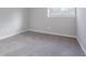 Empty bedroom with gray carpet and neutral walls at 4557 Greenleaf Sw Cir, Atlanta, GA 30331