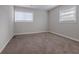 Simple bedroom with neutral walls and carpet flooring at 4557 Greenleaf Sw Cir, Atlanta, GA 30331