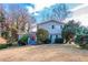 Two-story house with gray siding, red door, and landscaping at 4557 Greenleaf Sw Cir, Atlanta, GA 30331