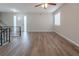 Bright living room with hardwood floors and a ceiling fan at 4557 Greenleaf Sw Cir, Atlanta, GA 30331