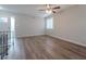 Spacious living room featuring hardwood floors and a ceiling fan at 4557 Greenleaf Sw Cir, Atlanta, GA 30331
