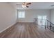 Bright and airy living room with hardwood floors and a ceiling fan at 4557 Greenleaf Sw Cir, Atlanta, GA 30331