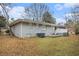 Ranch home with gray exterior and deck at 844 Parkstone Dr, Stone Mountain, GA 30083