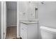 Clean bathroom with granite countertop, white vanity, and toilet at 844 Parkstone Dr, Stone Mountain, GA 30083