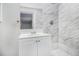 Bathroom with white vanity and marble tile shower at 844 Parkstone Dr, Stone Mountain, GA 30083