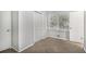 Bright bedroom with neutral walls, carpet, and double door closet at 844 Parkstone Dr, Stone Mountain, GA 30083