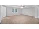 Spacious bedroom with neutral carpet and window at 844 Parkstone Dr, Stone Mountain, GA 30083