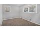 Bedroom with neutral carpet and two windows at 844 Parkstone Dr, Stone Mountain, GA 30083