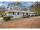 Ranch house with gray exterior and landscaping at 844 Parkstone Dr, Stone Mountain, GA 30083