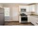 Updated kitchen with white cabinets and granite counters at 2168 Polar Rock Sw Pl, Atlanta, GA 30315