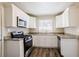 Modern kitchen with white cabinets and granite countertops at 2168 Polar Rock Sw Pl, Atlanta, GA 30315