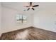 Bright bedroom with wood-look floors and ceiling fan at 21 Old Country Trl, Dallas, GA 30157