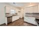 Modern kitchen with white cabinets, granite countertops, and stainless steel appliances at 21 Old Country Trl, Dallas, GA 30157