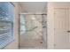 Large walk-in shower with marble walls and grab bar at 21 Old Country Trl, Dallas, GA 30157