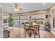 Bright sunroom with tile flooring, seating area, and plenty of natural light at 221 Oakwood Dr, Cumming, GA 30040