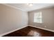 Bright bedroom with dark hardwood floors and neutral walls at 3166 Cloverhurst Dr, Atlanta, GA 30344