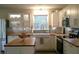 Modern kitchen with white cabinets, butcher block island, and farmhouse sink at 11350 Cranwood Cv, Roswell, GA 30075