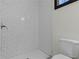 Clean bathroom with white subway tile shower and toilet at 391 S Bend Se Ave, Atlanta, GA 30315