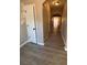 Bright entryway with grey wood-look floors and archways at 2429 Birkhall Way, Lawrenceville, GA 30043