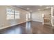 Open living area with hardwood floors and access to backyard at 2463 Quay Rdg, Lawrenceville, GA 30044