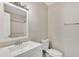 Clean bathroom with white vanity, toilet and mirror at 341 Red Oak Sw Run, Marietta, GA 30008