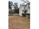 Side view of two-story house with gray siding, and a wooden fence at 105 Birch St, Hiram, GA 30141