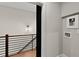 Modern hallway with black barn door and a staircase at 2329 Mason Dr # D24, Atlanta, GA 30316